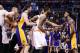 Jan 15, 2014; Phoenix, AZ, USA; Los Angeles Lakers forward Nick Young (right) yells as Phoenix Suns center Alex Len (left) is held back by NBA officials. Phoenix Suns forward Marcus Morris (15) and forward Markieff Morris (11) step in the middle in the first half at US Airways Center. Mandatory Credit: Jennifer Stewart-USA TODAY Sports