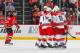 NEWARK, NJ - NOVEMBER 27: Justin Faulk #27 of the Carolina Hurricanes is congratulated by his teammates after scoring a first-period goal as Steve Bernier #18 of the New Jersey Devils skates away during the game at the Prudential Center on November 27, 2013 in Newark, New Jersey. (Photo by Andy Marlin/NHLI via Getty Images)