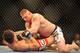 LAS VEGAS - JULY 11: Brock Lesnar holds down Frank Mir during their heavyweight title bout during UFC 100 on July 11, 2009 in Las Vegas, Nevada. Lesnar defeated Mir by a second round knockout. (Photo by Jon Kopaloff/Getty Images)