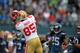 San Francisco 49ers' Vernon Davis catches a pass against the Seattle Seahawks in the first half of an NFL football game in Seattle Saturday, Dec. 24, 2011. (AP Photo/John Froschauer)