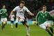 England's Adam Lallana, left, control the ball away from Germany's Lars Bender during the international friendly soccer match between England and Germany, at Wembley Stadium in London, Tuesday, Nov. 19, 2013. (AP Photo/Kirsty Wigglesworth)