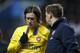 Arsenal's Tomas Rosicky, left, has to change his shirt after an injury due to blood on it during the English Premier League soccer match between Aston Villa and Arsenal at Villa Park stadium in Birmingham, England, Monday, Jan. 13, 2014. (AP Photo/Kirsty Wigglesworth)