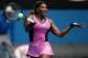 Serena Williams of the United States makes a forehand return to Vesna Dolonc of Serbia during their second round match at the Australian Open tennis championship in Melbourne, Australia, Wednesday, Jan. 15, 2014.(AP Photo/Aaron Favila)