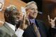 New Texas football Charlie Strong, left, poses for a photo with athletic director Steve Patterson, right, both displaying the