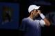 Serbia's Novak Djokovic reacts as he plays Andy Roddick of the United States in a Men's singles match at the Australian Open Tennis Championship in Melbourne, Australia, Tuesday, Jan. 27, 2009. Djokovic retired from the match due to heat stress. (AP Photo/Andrew Brownbill)