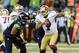 Sep 15, 2013; Seattle, WA, USA; San Francisco 49ers quarterback Colin Kaepernick (7) runs from Seattle Seahawks defensive end Red Bryant (79) during the 2nd half at CenturyLink Field. Seattle defeated San Francisco 29-3. Mandatory Credit: Steven Bisig-USA TODAY Sports