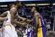 Los Angeles Lakers' Nick Young, right, has words with Phoenix Suns' Marcus Morris and Markieff Morris, rear, during the first half of an NBA basketball game Wednesday, Jan. 15, 2014, in Phoenix. Young was ejected from the game along with Suns' Alex Len. (AP Photo/Ross D. Franklin)