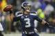 Seattle Seahawks quarterback Russell Wilson (3) passes against the New Orleans Saints during the second half of an NFC divisional playoff NFL football game in Seattle, Saturday, Jan. 11, 2014. (AP Photo/Ted S. Warren)