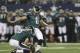Philadelphia Eagles kicker Alex Henery (6) kicks a field goal with teammate Donnie Jones (8) during the first half of an NFL football game against the Dallas Cowboys Sunday, Dec. 29, 2013, in Arlington, Texas.(AP Photo/Tim Sharp)