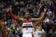 Washington Wizards guard John Wall (2) celebrates in the second half of an NBA basketball game against the Miami Heat, Wednesday, Jan. 15, 2014, in Washington. The Wizards won 114-97. (AP Photo/Alex Brandon)