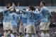 Manchester City's Edin Dzeko, right, celebrates with teammates after scoring against Cardiff City during their English Premier League soccer match at the Etihad Stadium, Manchester, England, Saturday Jan 18, 2014. (AP Photo/Jon Super)