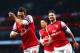 LONDON, ENGLAND - JANUARY 18: Santi Cazorla of Arsenal (L) celebrates with Olivier Giroud (R) as he scores their first goal during the Barclays Premier League match between Arsenal and Fulham at Emirates Stadium on January 18, 2014 in London, England. (Photo by Clive Mason/Getty Images)