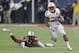 Wisconsin running back James White (20) gains yardage as he breaks away from South Carolina linebacker Skai Moore (10)during the first half of the Capital One Bowl NCAA college football game in Orlando, Fla., Wednesday, Jan. 1, 2014.(AP Photo/John Raoux)