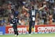 New Zealand's Mitchell McClenaghan (81) runs towards Luke Ronchi after he took the catch off his bowling to dismiss India’s MS Dhoni for 40 in their first one day international cricket match at McLean Park in Napier, New Zealand, Sunday, Jan. 19, 2014. (AP Photo/SNPA, Ross Setford) NEW ZEALAND OUT