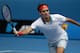 Roger Federer of Switzerland makes a forehand return to Teymuraz Gabashvili of Russia during their third round match at the Australian Open tennis championship in Melbourne, Australia, Saturday, Jan. 18, 2014.(AP Photo/Aaron Favila)