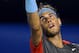 Rafael Nadal of Spain serves to Gael Monfils of France during their third round match at the Australian Open tennis championship in Melbourne, Australia, Saturday, Jan. 18, 2014.(AP Photo/Aaron Favila)