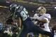 Seattle Seahawks' Doug Baldwin (89) comes down with a touchdown catch past the defense of San Francisco 49ers' Carlos Rogers (22) in the second half of an NFL football game, Sunday, Dec. 23, 2012, in Seattle. (AP Photo/Elaine Thompson)