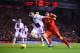 LIVERPOOL, ENGLAND - JANUARY 18: Luis Suarez of Liverpool challenges Ciaran Clark of Aston Villa during the Barclays Premier League match between Liverpool and Aston Villa at Anfield on January 18, 2014 in Liverpool, England. (Photo by Michael Regan/Getty Images)