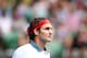 MELBOURNE, AUSTRALIA - JANUARY 18: Roger Federer of Switzerland looks on in his third round match against Teymuraz Gabashvili of Russia during day six of the 2014 Australian Open at Melbourne Park on January 18, 2014 in Melbourne, Australia. (Photo by Cameron Spencer/Getty Images)