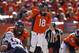 Jan 19, 2014; Denver, CO, USA; Denver Broncos quarterback Peyton Manning (18) signals during the first half against the New England Patriotsduring the 2013 AFC championship playoff football game at Sports Authority Field at Mile High. Mandatory Credit: Chris Humphreys-USA TODAY Sports