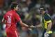 England captain Alastair Cook, left, shakes hands with Australia Shaun Marsh After their one-day international cricket match at the Sydney Cricket Ground in Sydney, Australia, Sunday, Jan. 19, 2014. Australia won the match by seven wickets. (AP Photo/Rob Griffith)