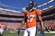 Denver Broncos running back Knowshon Moreno (27) walks across the field before the AFC Championship NFL playoff football game against the New England Patriots in Denver, Sunday, Jan. 19, 2014. (AP Photo/Jack Dempsey)