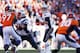 DENVER, CO - JANUARY 19: Tom Brady #12 of the New England Patriots looks to pass against the Denver Broncos during the AFC Championship game at Sports Authority Field at Mile High on January 19, 2014 in Denver, Colorado. (Photo by Kevin C. Cox/Getty Images)