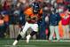 DENVER, CO - DECEMBER 8: Running back Knowshon Moreno #27 of the Denver Broncos rushes against the Tennessee Titans during a game at Sports Authority Field Field at Mile High on December 8, 2013 in Denver, Colorado. (Photo by Dustin Bradford/Getty Images)