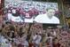 Alabama fans react as the Crimson Tide runs on the field during the first half of an NCAA college football game against Mississippi in Tuscaloosa, Ala., Saturday, Sept. 28, 2013. (AP Photo/Dave Martin)