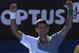 Novak Djokovic of Serbia celebrates his win over Fabio Fognini of Italy during their fourth round match at the Australian Open tennis championship in Melbourne, Australia, Sunday, Jan. 19, 2014.(AP Photo/Eugene Hoshiko)