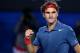 Roger Federer of Switzerland celebrates after defeating Jo-Wilfried Tsonga of France during their fourth round match at the Australian Open tennis championship in Melbourne, Australia, Monday, Jan. 20, 2014.(AP Photo/Aaron Favila)