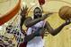 Houston Rockets' James Harden, center, is fouled by Milwaukee Bucks' Larry Sanders, left, during the first quarter of an NBA basketball game Saturday, Jan. 18, 2014, in Houston. (AP Photo/David J. Phillip)