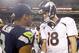 Aug 17, 2013; Seattle, WA, USA; Seattle Seahawks quarterback Russell Wilson (3) and Denver Broncos quarterback Peyton Manning (18) speak following a 40-10 preseason victory by the Seahawks at CenturyLink Field. Mandatory Credit: Joe Nicholson-USA TODAY Sports