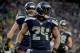 SEATTLE, WA - JANUARY 11: Running back Marshawn Lynch #24 of the Seattle Seahawks celebrates after he scores a 31-yard touchdown run against the New Orleans Saints in the fourth quarter during the NFC Divisional Playoff Game at CenturyLink Field on January 11, 2014 in Seattle, Washington. (Photo by Harry How/Getty Images)