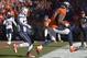 Denver Broncos wide receiver Demaryius Thomas (88) runs into the end zone on a three-yard touchdown pass against New England Patriots cornerback Alfonzo Dennard during the second half of the AFC Championship NFL playoff football game in Denver, Sunday, Jan. 19, 2014. (AP Photo/Jack Dempsey)
