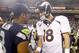 Aug 17, 2013; Seattle, WA, USA; Seattle Seahawks quarterback Russell Wilson (3) and Denver Broncos quarterback Peyton Manning (18) speak following a 40-10 preseason victory by the Seahawks at CenturyLink Field. Mandatory Credit: Joe Nicholson-USA TODAY Sports