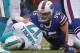 Buffalo Bills defensive tackle Kyle Williams (95) sacks Miami Dolphins quarterback Ryan Tannehill (17) during the first half of an NFL football game on Sunday, Dec. 22, 2013, in Orchard Park, N.Y. (AP Photo/Bill Wippert)