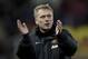 Manchester United's manager David Moyes applaudssupporters after his team's 2-0 win against Stoke in their English League Cup quarter-final soccer match at the Britannia Stadium, Stoke, England, Wednesday Dec. 18, 2013. (AP Photo/Jon Super)