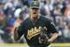 Oakland Athletics relief pitcher Grant Balfour clenches his fist after the final out Game 3 of an American League baseball division series against the Detroit Tigers in Detroit, Monday, Oct. 7, 2013. Oakland won 6-3. (AP Photo/Lon Horwedel)