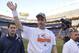 Denver Broncos quarterback Peyton Manning waves as he walks off the field after the AFC Championship NFL playoff football game in Denver, Sunday, Jan. 19, 2014. The Broncos defeated the Patriots 26-16 to advance to the Super Bowl. (AP Photo/Jack Dempsey)