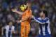 Real Madrid's Karim Benzema, left, duels for the ball against Espanyol's Diego Colotto during a Spanish La Liga soccer match at Cornella-El Prat stadium in Cornella Llobregat, Spain, Sunday, Jan. 12, 2014. (AP Photo/Manu Fernandez)