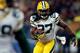 CHICAGO, IL - DECEMBER 29: Running back Eddie Lacy #27 of the Green Bay Packers carries the ball against the Chicago Bears during a game at Soldier Field on December 29, 2013 in Chicago, Illinois. (Photo by Jonathan Daniel/Getty Images)
