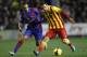 Barcelona's Lionel Messi from Argentina duels for the ball with Levante's El Zhar from France during their La Liga soccer match at the Ciutat de Valencia stadium in Valencia, Spain, Sunday, Jan. 19, 2014. (AP Photo/Alberto Saiz)