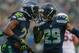 SEATTLE, WA - DECEMBER 22: Cornerback Richard Sherman #25 of the Seattle Seahawks celebrates with free safety Earl Thomas #29 after making an interception against the Arizona Cardinals at CenturyLink Field on December 22, 2013 in Seattle, Washington. (Photo by Otto Greule Jr/Getty Images)