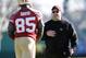 San Francisco 49ers offensive coordinator Greg Roman, right, talks with tight end Vernon Davis (85) during NFL football practice in Santa Clara, Calif., Thursday, Jan. 5, 2012. Roman is being considered for the Penn State head coaching job. The 49ers are scheduled to play in a divisional playoff game on Jan. 14. (AP Photo/Paul Sakuma)