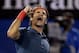 Roger Federer of Switzerland celebrates after defeating Andy Murray of Britain during their quarterfinal at the Australian Open tennis championship in Melbourne, Australia, Wednesday, Jan. 22, 2014.(AP Photo/Rick Rycroft)