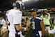 Seattle Seahawks quarterback Russell Wilson (3) shakes hands with Denver Broncos quarterback Peyton Manning, left, after the Seahawks beat the Broncos 40-10, in preseason NFL football game, Saturday, Aug. 17, 2013, in Seattle. (AP Photo/John Froschauer)