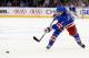 NEW YORK, NY - JANUARY 10: Michael Del Zotto #4 of the New York Rangers takes a shot in the second period against the Dallas Stars at Madison Square Garden on January 10, 2014 in New York City. (Photo by Elsa/Getty Images)