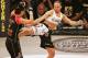 Kaitlin Young, right, kicks Gina Carano in their EliteXC 140 lbs. bout at the Prudential Center in Newark, N.J. Saturday, May 31, 2008. (AP Photo/Rich Schultz)