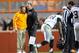 Nov 23, 2013; Knoxville, TN, USA; Tennessee Volunteers head coach Butch Jones and Vanderbilt Commodores head coach James Franklin meet on the field while injured Vanderbilt Commodores defensive back Steven Clarke (12) is attended to at Neyland Stadium. Vanderbilt won 14 to 10. Mandatory Credit: Randy Sartin-USA TODAY Sports